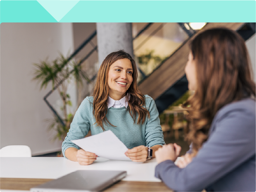 Two women in an office setting
