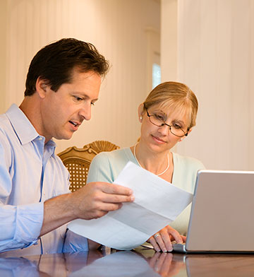 Couple filling out financial paperwork