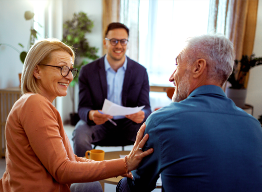 An older couple meeting with a financial advisor
